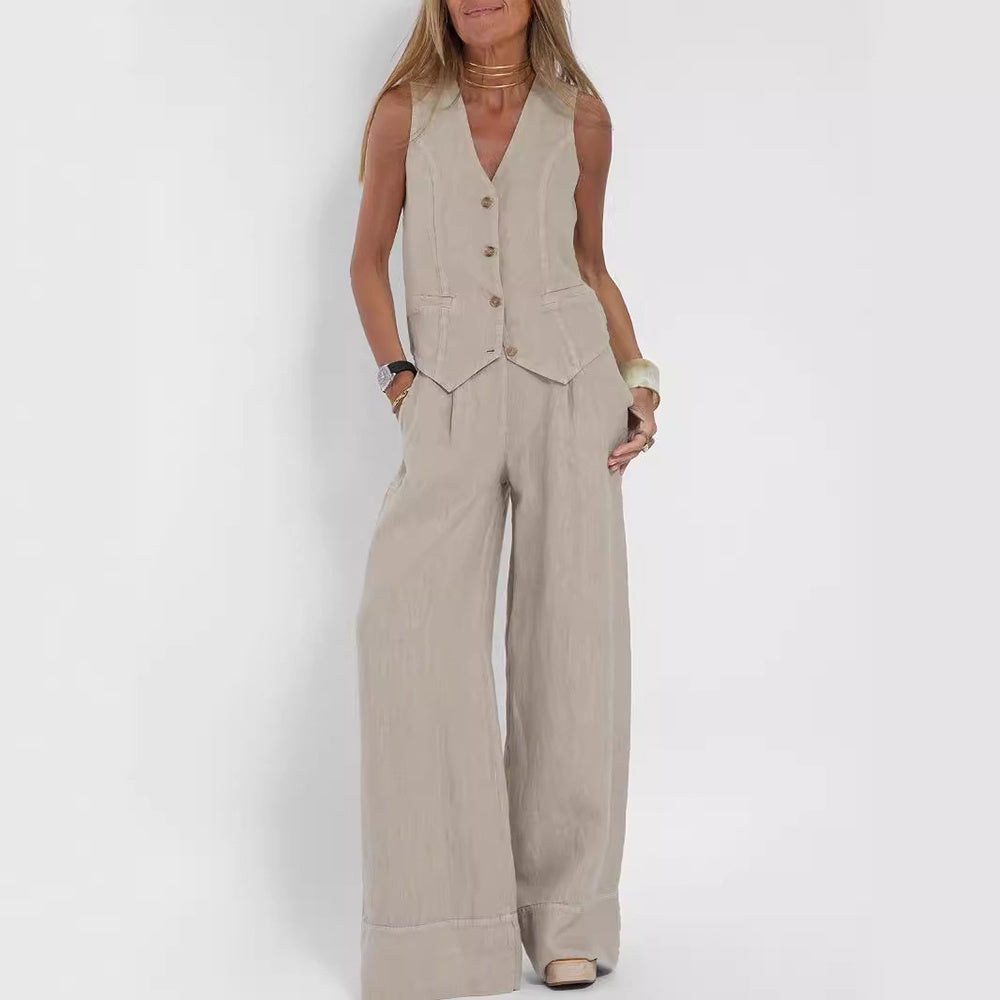 A woman's back view wearing a beige V-neck sleeveless top and matching loose trousers.