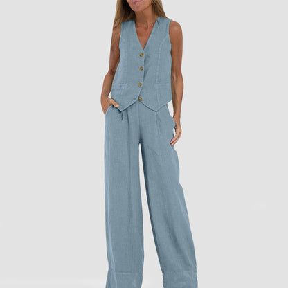 A woman's back view wearing a beige V-neck sleeveless top and matching loose trousers.